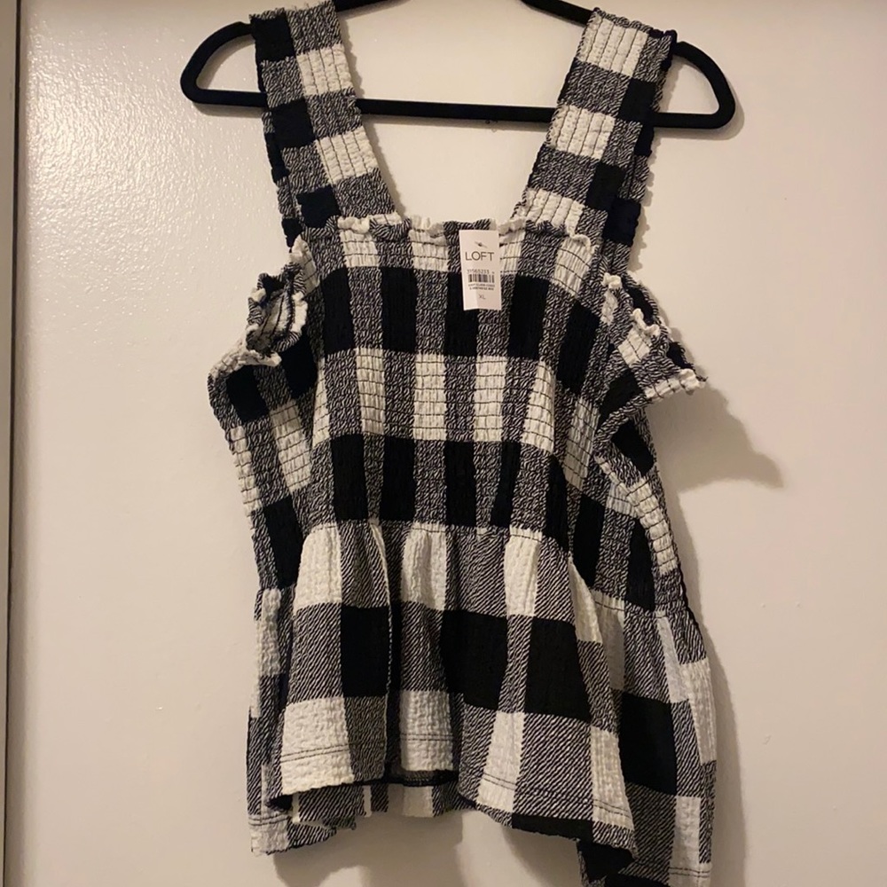 Sleeveless never worn peplum Loft top.